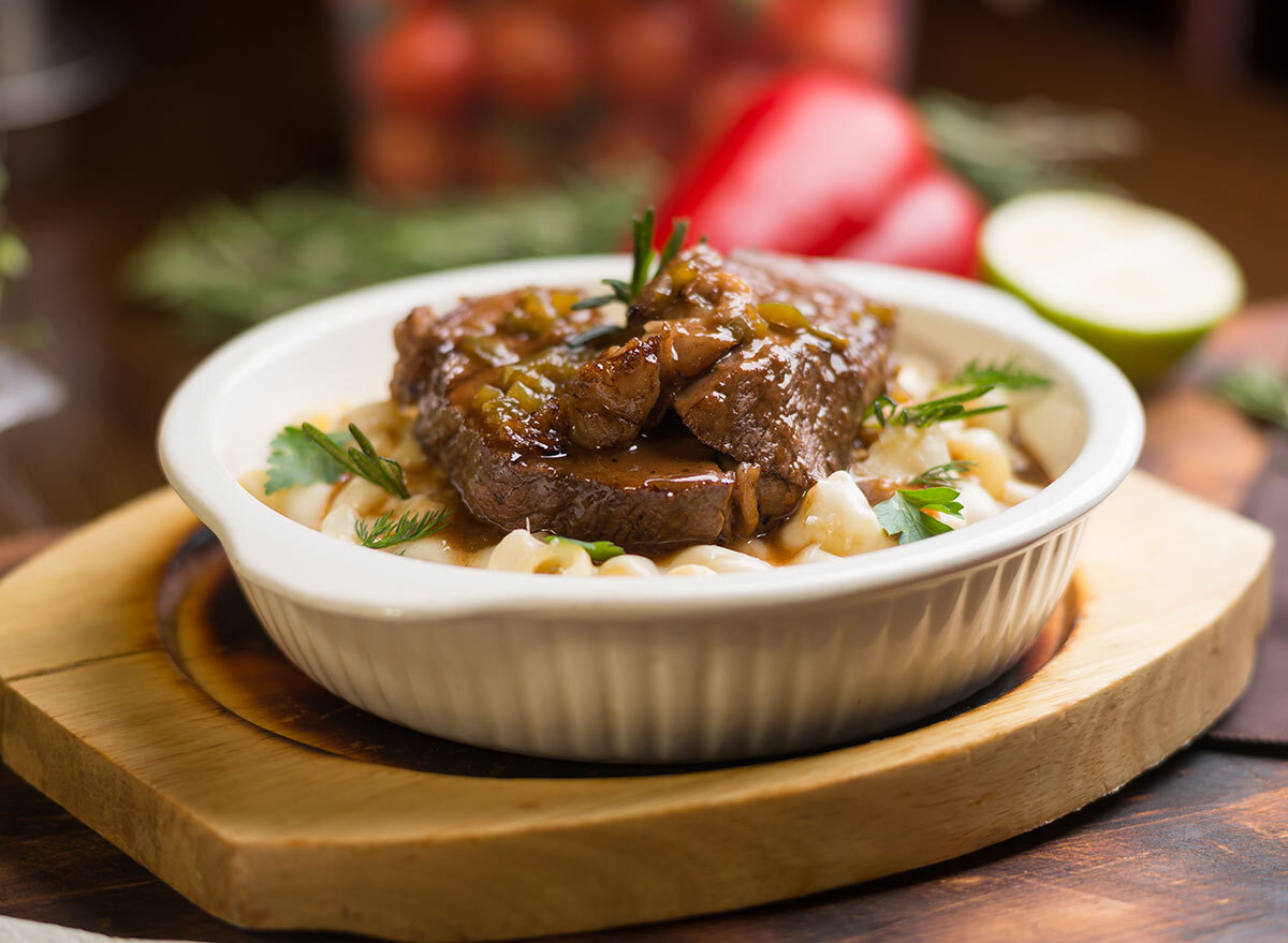 beef tips on a plate with potatoes