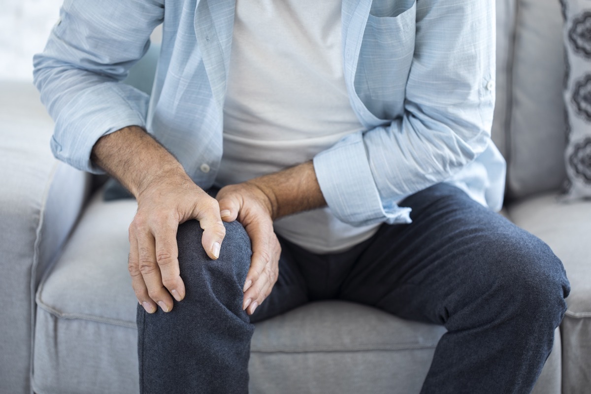 Man experiencing joint pain in his knee