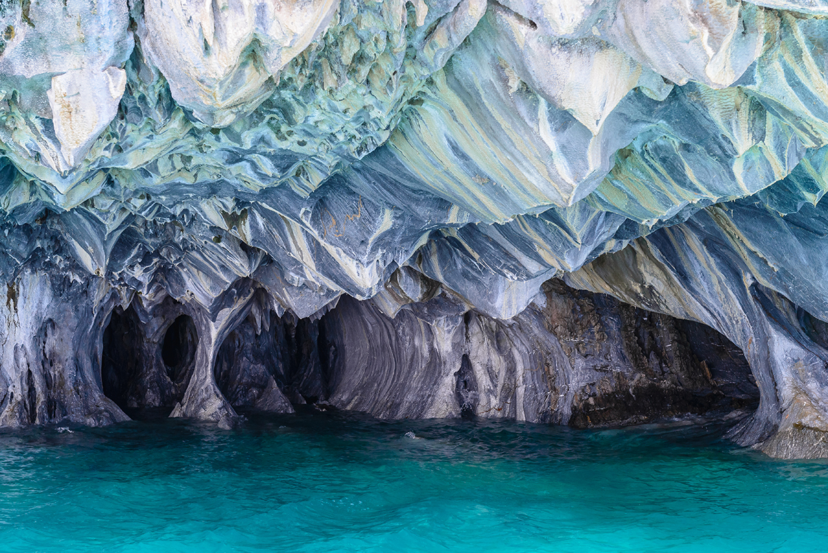 multihued blue water reflecting an underwater cave in Chile