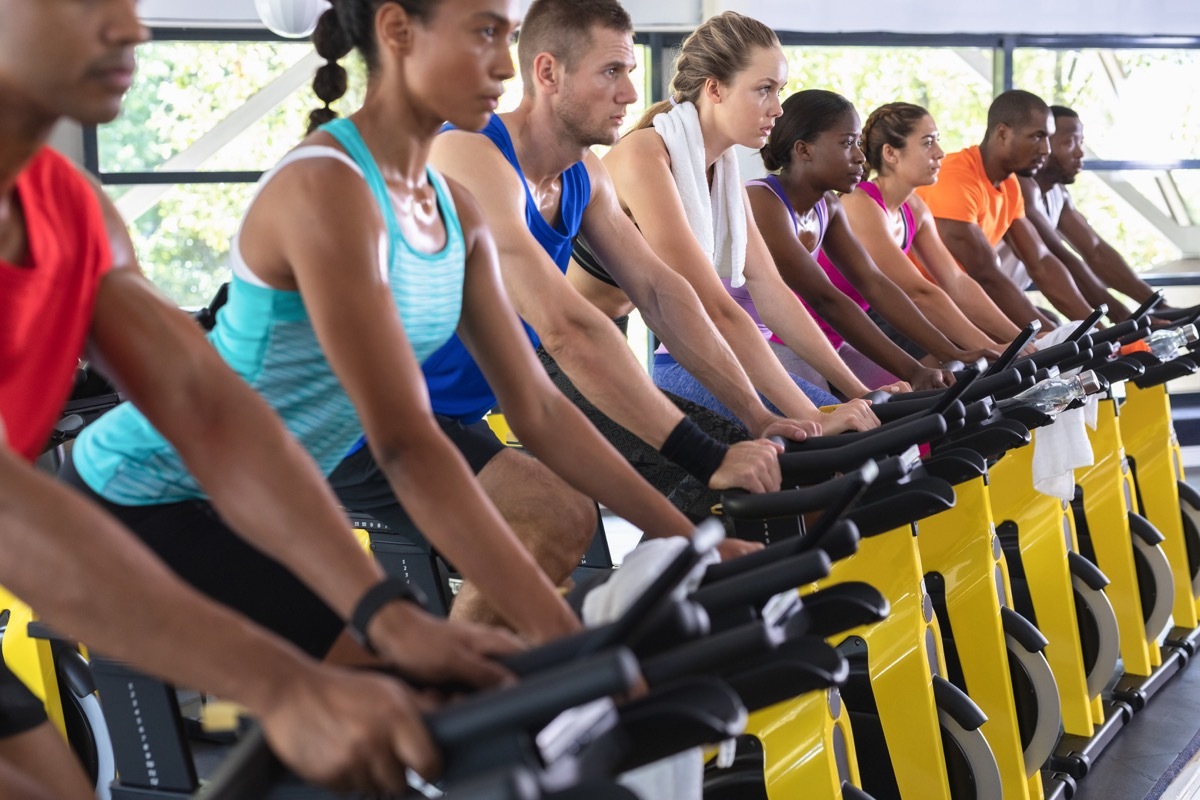 People on gym's cycle equipment