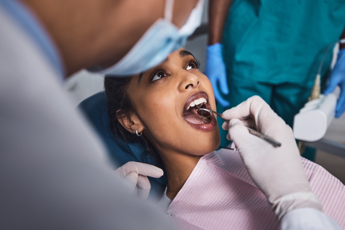 Shot of a young woman having dental work done on her teeth