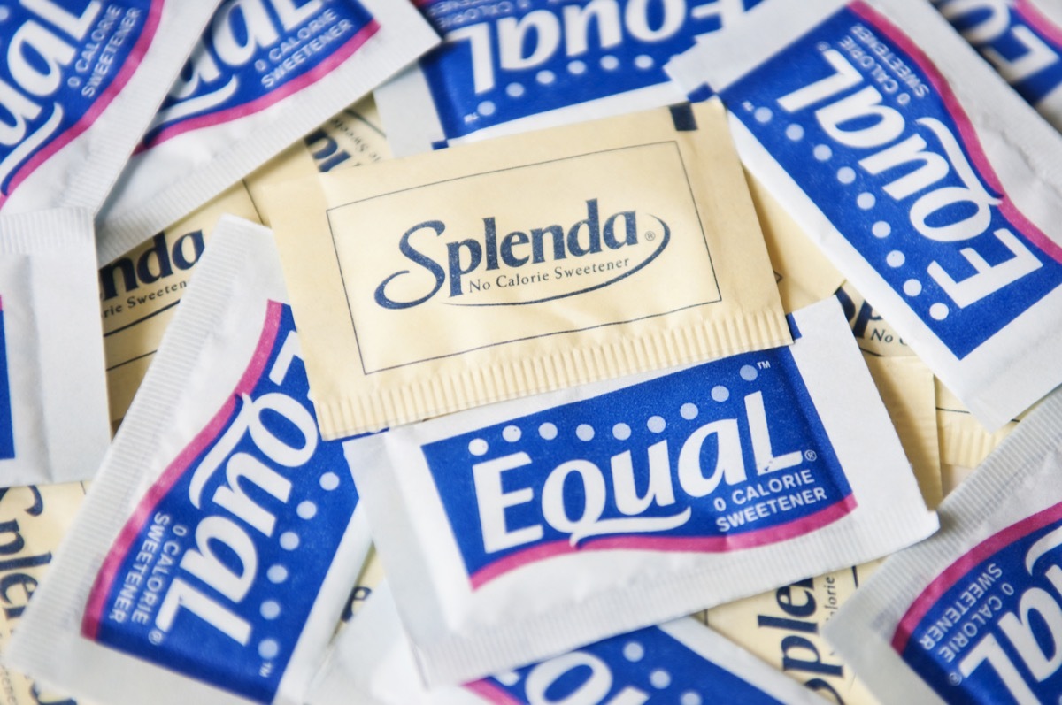 New York, USA - May 20, 2011: Splenda and Equal Product Shot zero calorie sweeteners: Splenda in a yellow packet, Equal in a blue packet. Splenda and Equal are artificial sweeteners used as a sugar substitute.