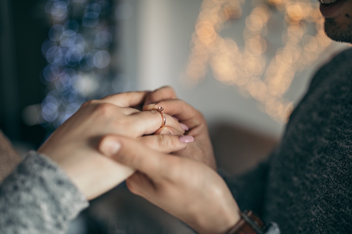 young man is proposing to his girlfriend