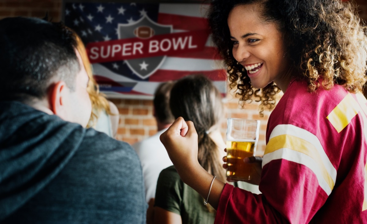 Friends cheering sport at bar together