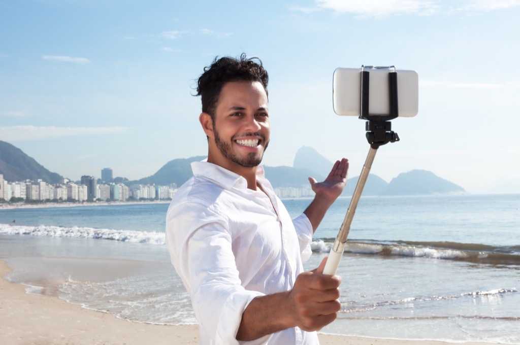 Man taking selfie on beach