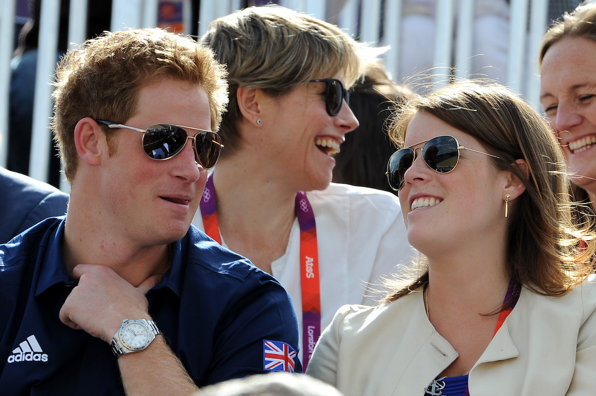 Prince Harry, and Princess Eugenie watch the Eventing Cross Country Equestrian event on Day 3 of the London 2012 Olympic Games at Greenwich Park on July 30, 2012 in London, England.