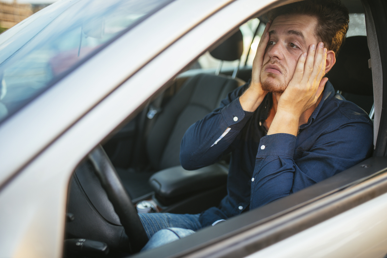 Desperate young driver, can't stand the traffic jam