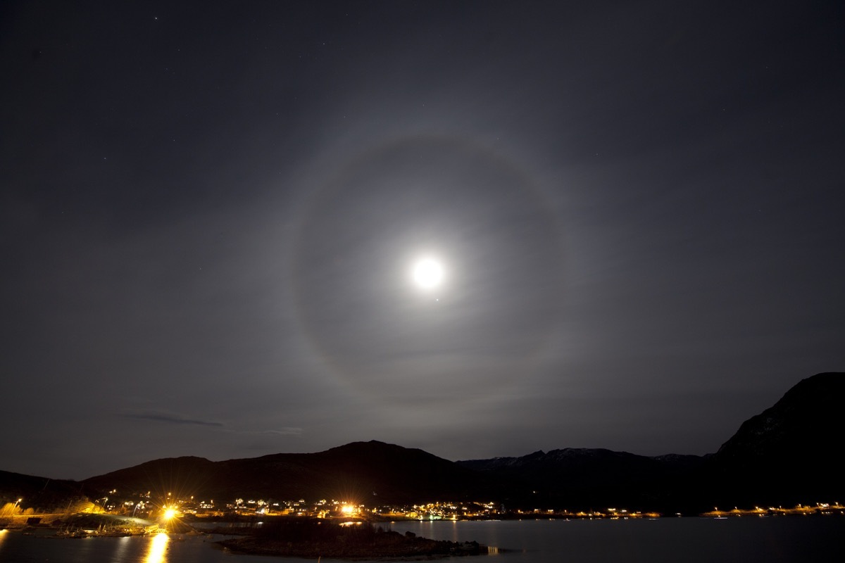 A halo around the moon over the city of TromsA in arctic Norway.