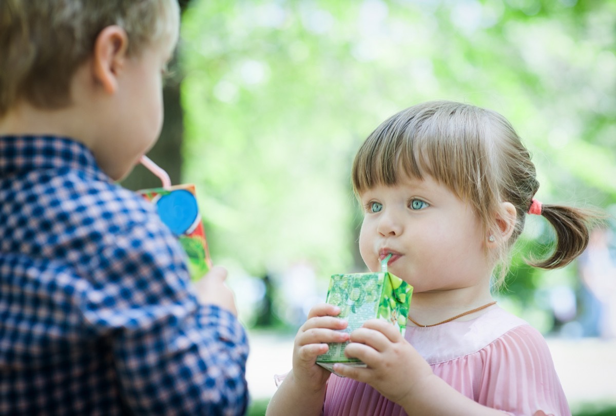 Girl Drinking a Juice Box Childhood Habits that Affect Health