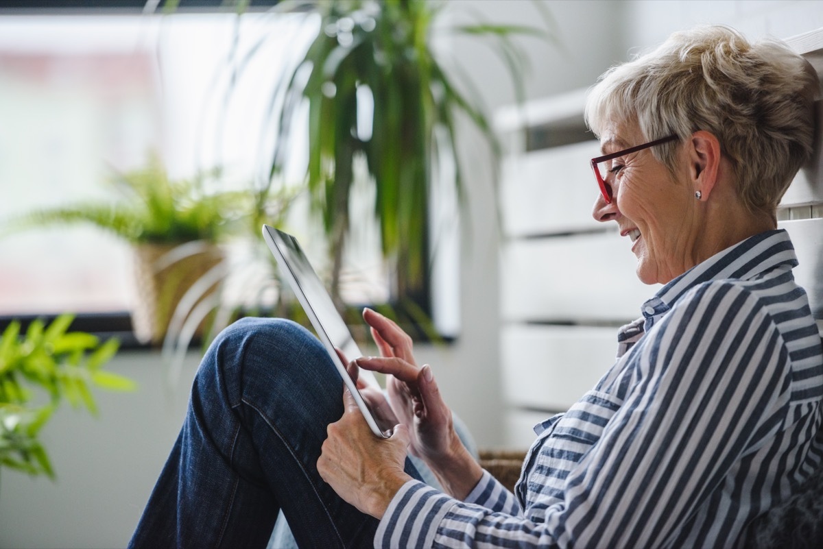 older woman using tablet