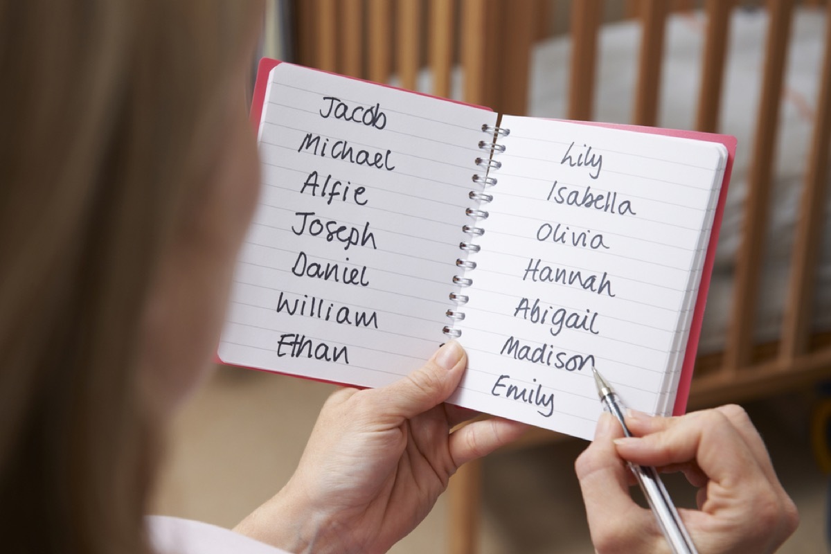 woman writing down a list of baby names, things that annoy grandparents