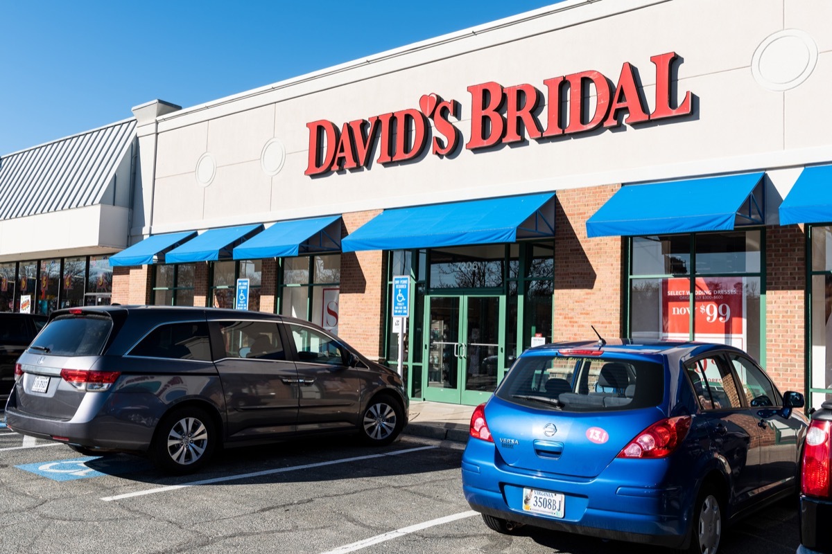 Springfield, USA - January 14, 2018: Storefront of David's Bridal retail store, shop selling wedding dresses, clothes, garment with sign, parked cars, parking lot