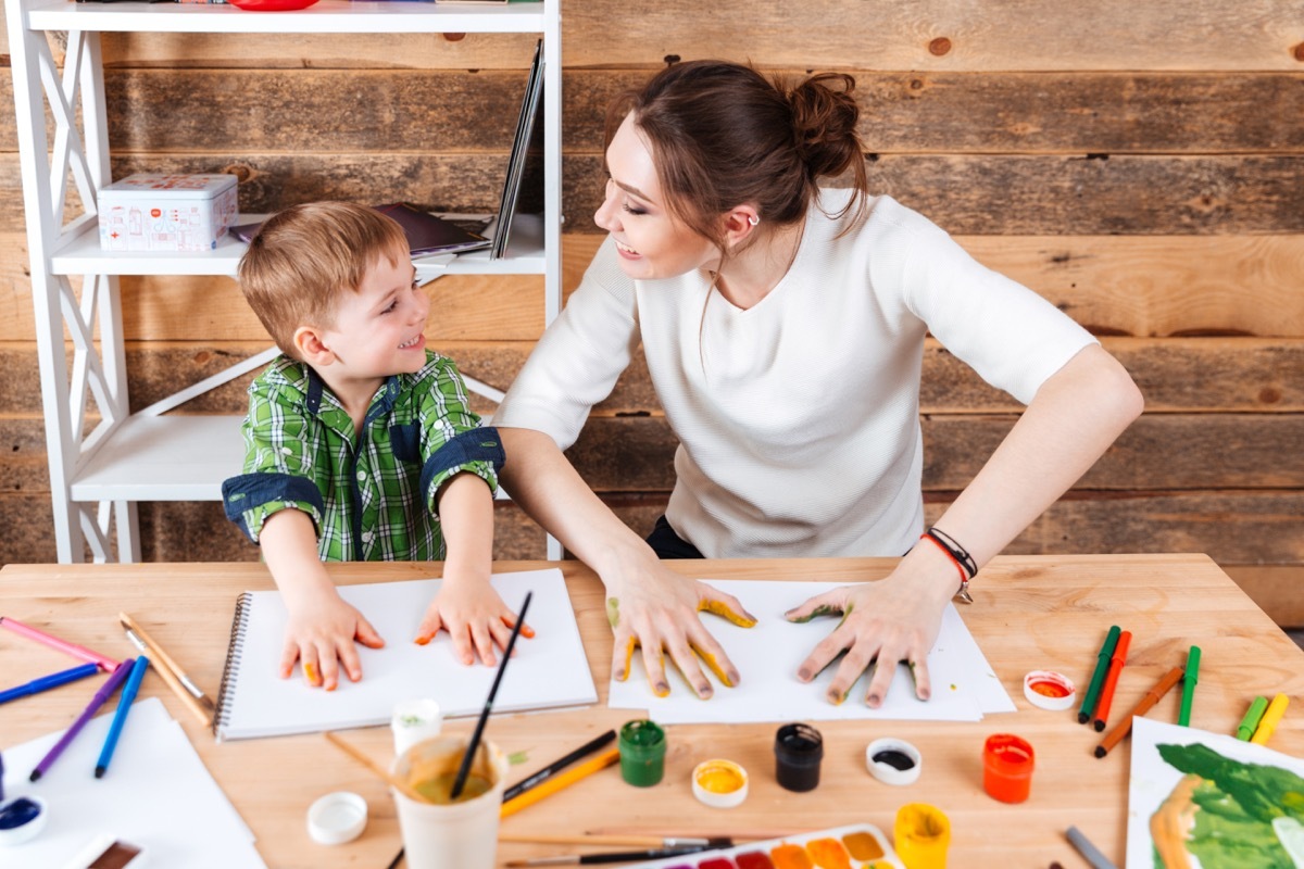 mother and son finger painting