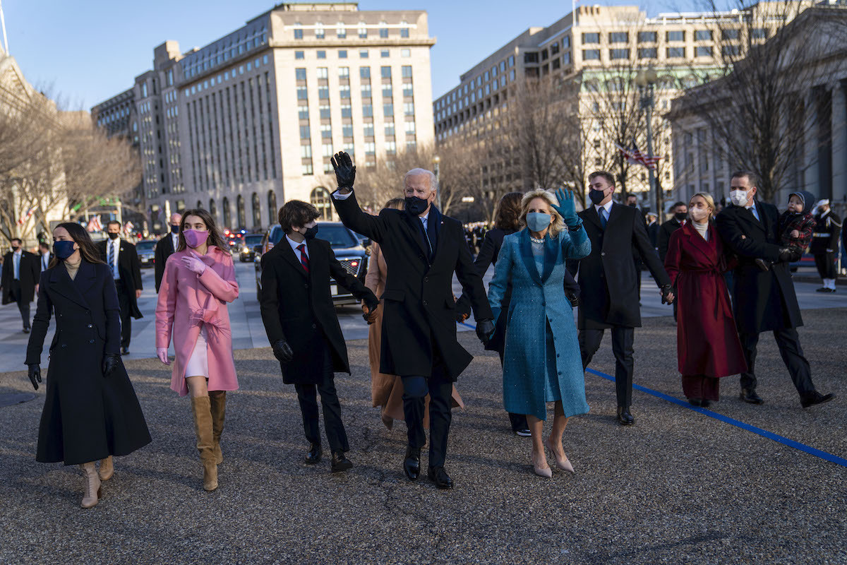 President Joe Biden and First Lady Dr. Jill Biden walk along Pennsylvania Avenue in front of the White House during Inaugural celebrations, Wednesday, Jan. 20, 2021.