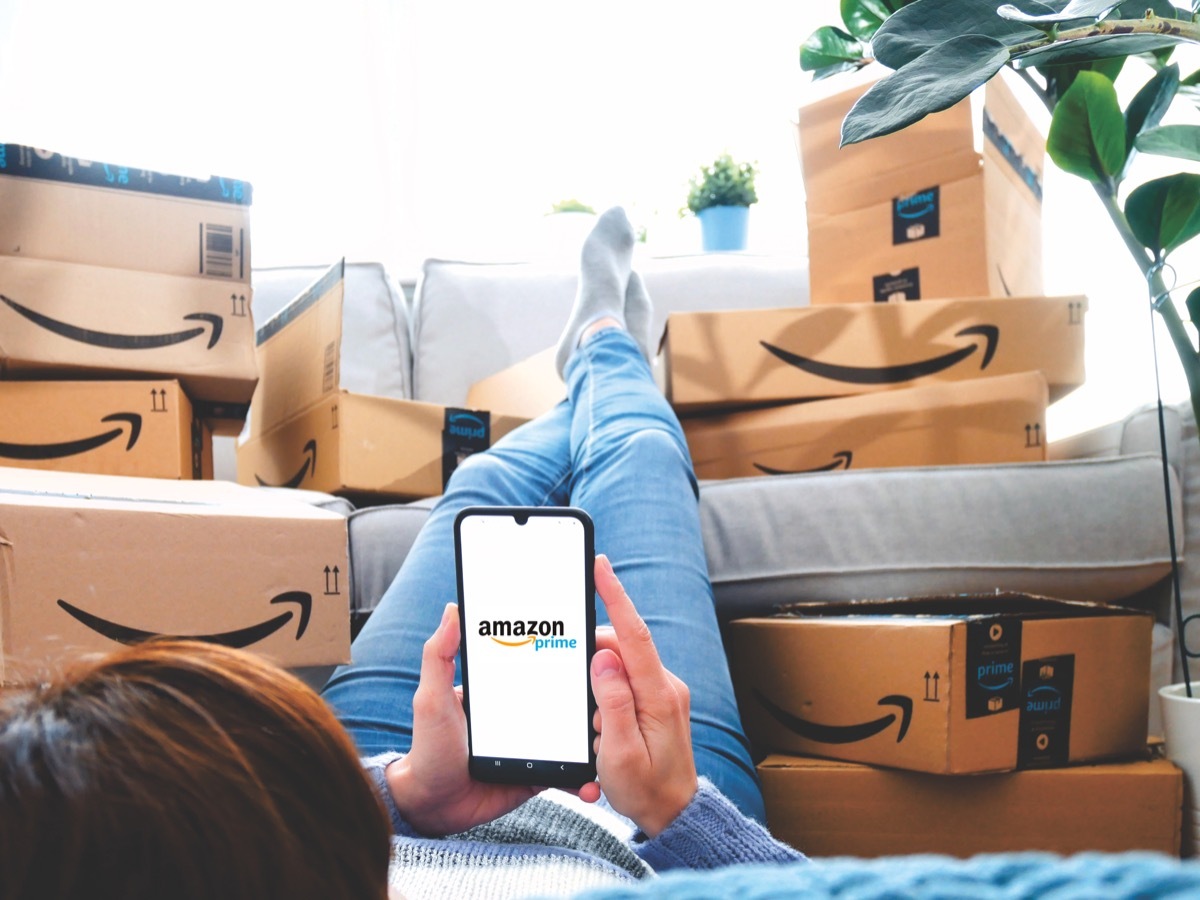 Person Surrounded by Amazon Boxes