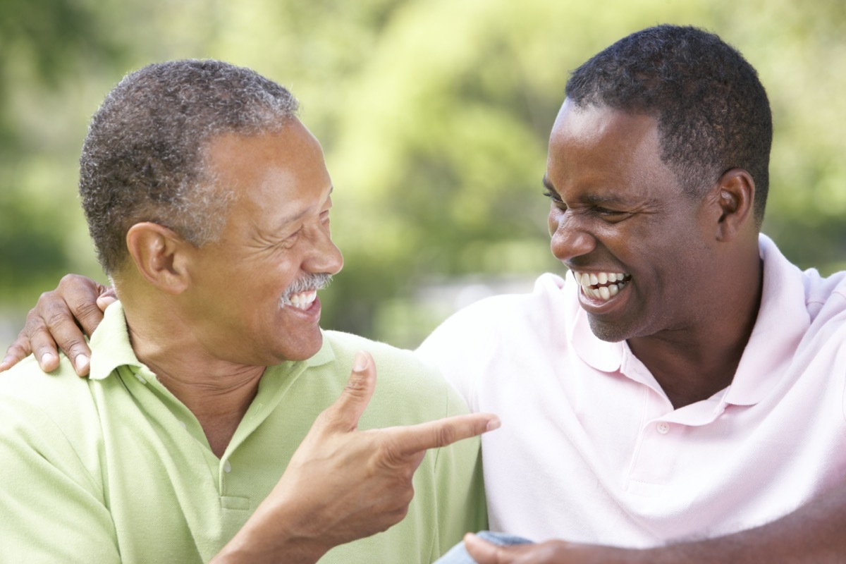 father and son laughing