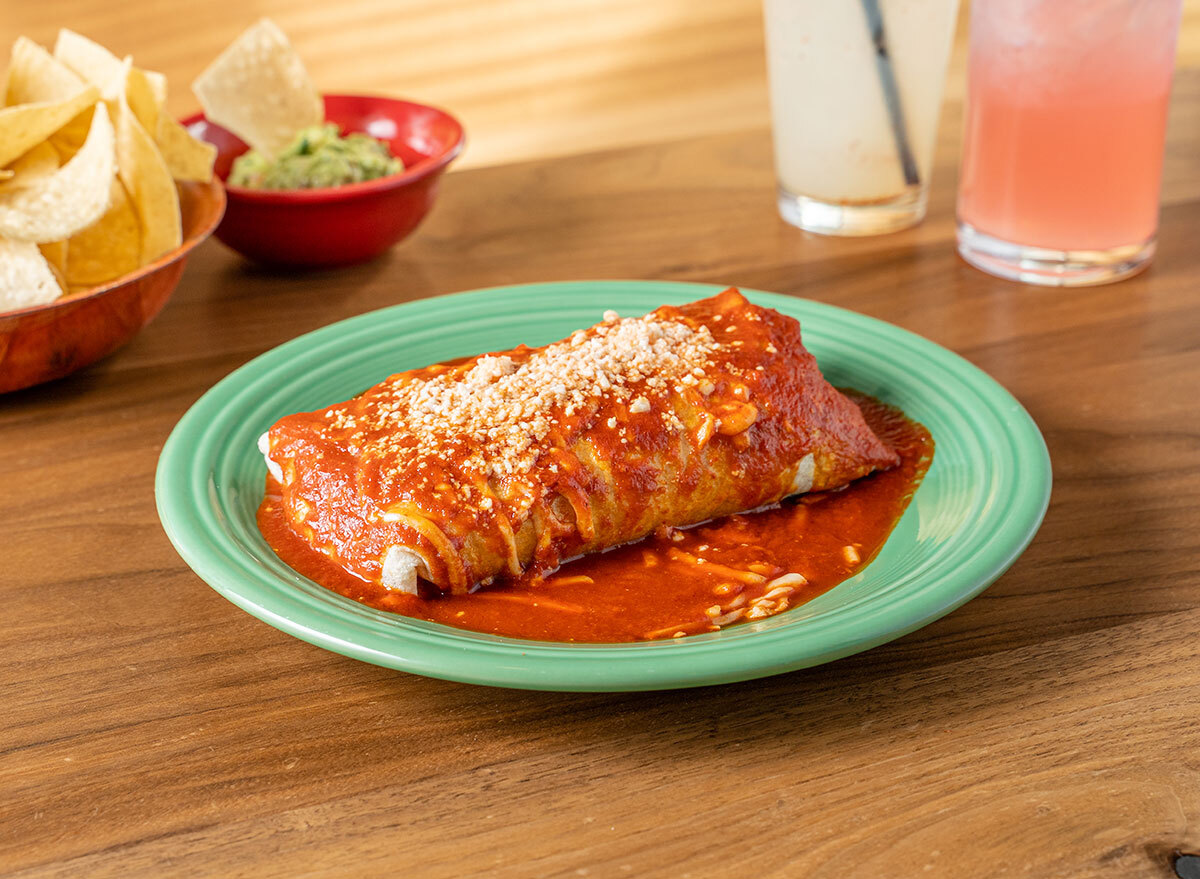 wet burrito on green plate