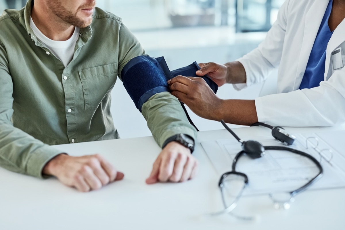 Closeup shot of a doctor checking a patient's blood pressure