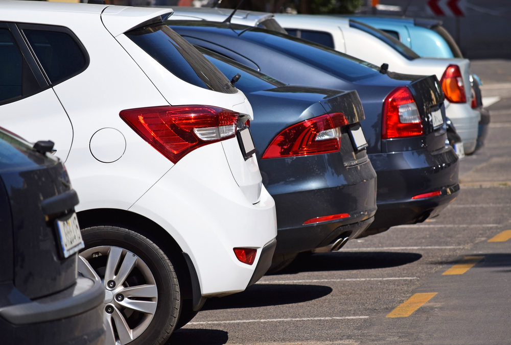 A line up of cars in a parking lot