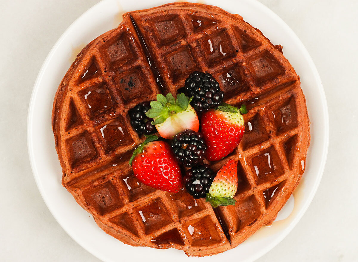 chocolate protein waffle with fresh berries on a plate