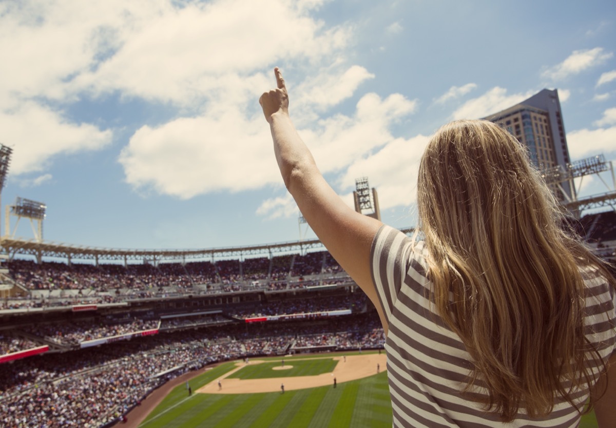 Woman cheering at baseball game