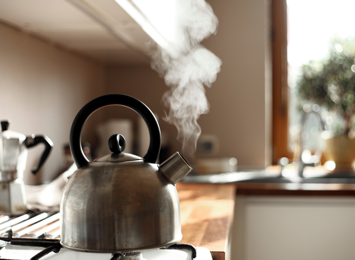 tea kettle boiling steaming on stove