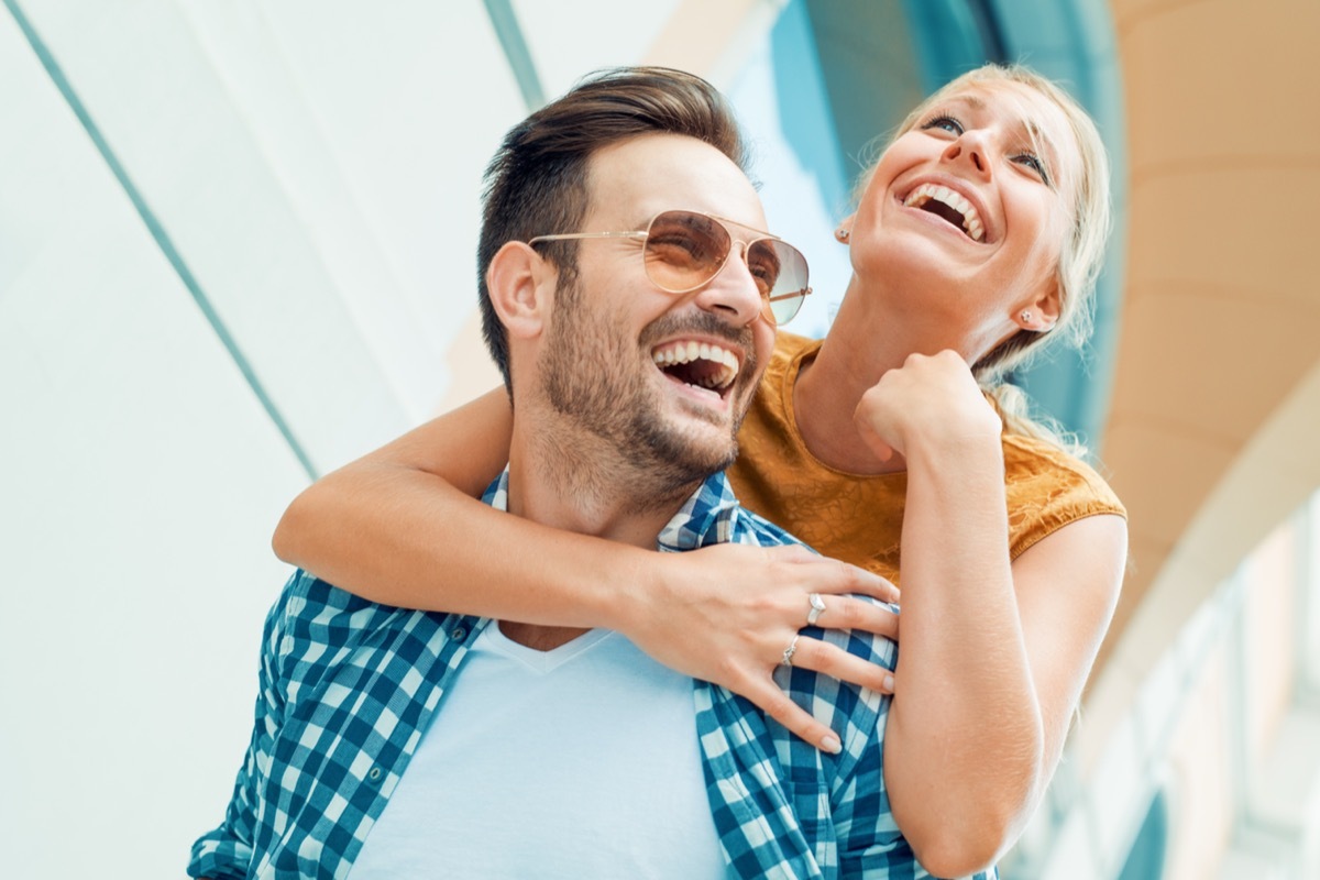 woman getting a piggyback from her boyfriend