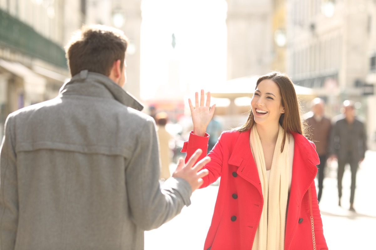 woman meets her friend on a city street and provides a funny response to 