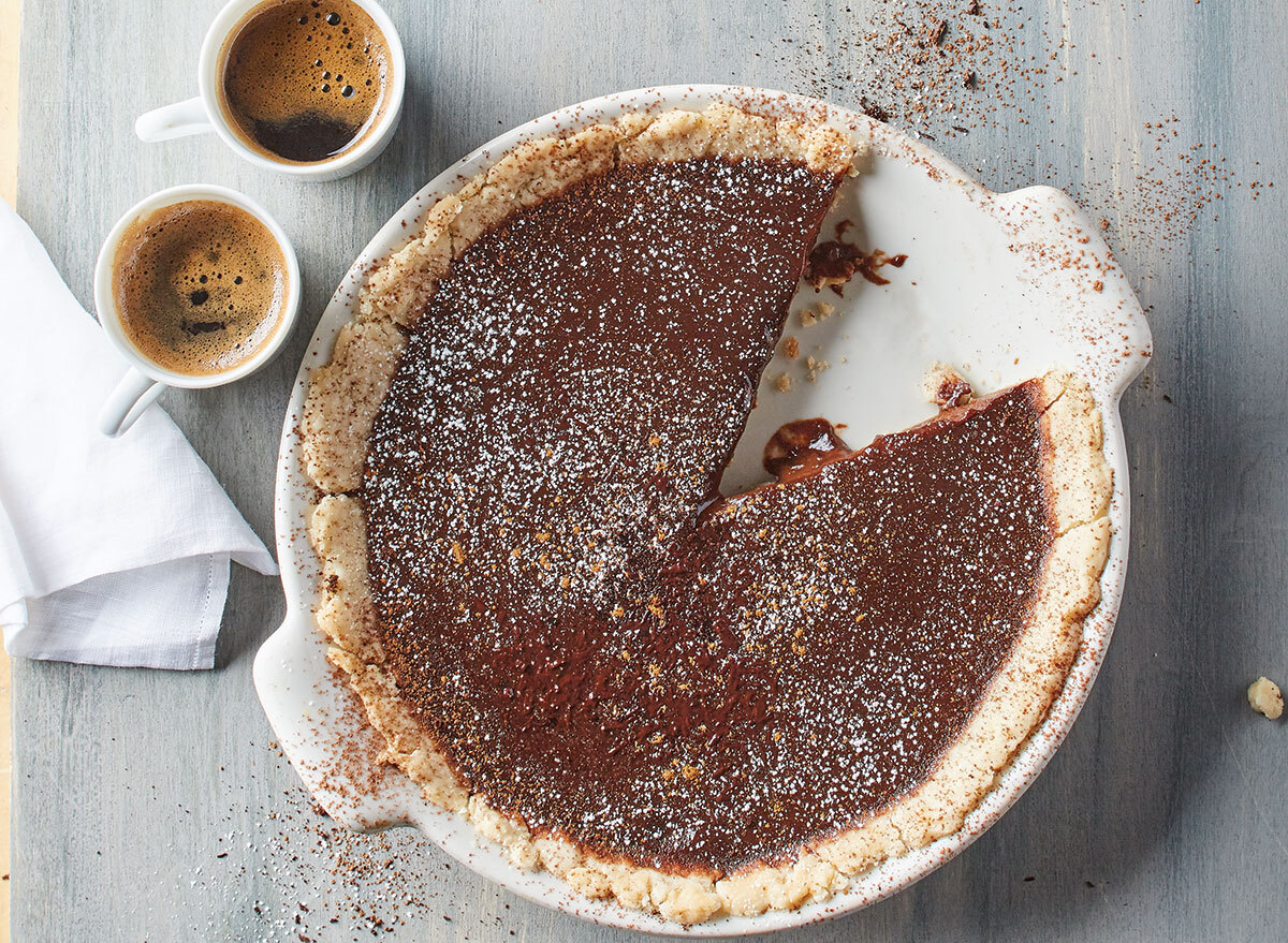 warm mocha tart with espresso cups and napkin