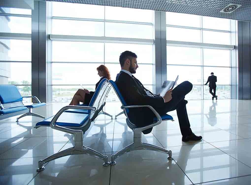 stressed out man waiting at airport