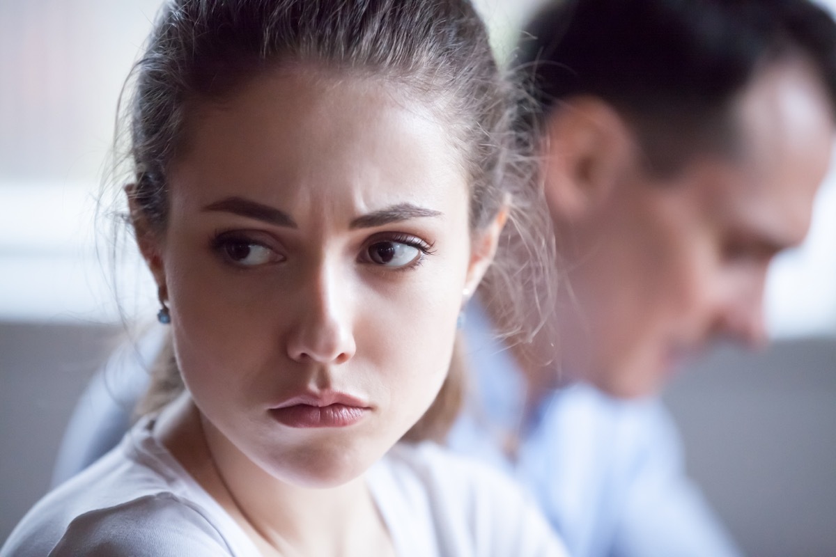 Close up of pretty sad woman feel upset after family fight, spouses avoid talking after disagreement, offended wife angry having dispute or misunderstanding with husband, mad spouses ignore each other