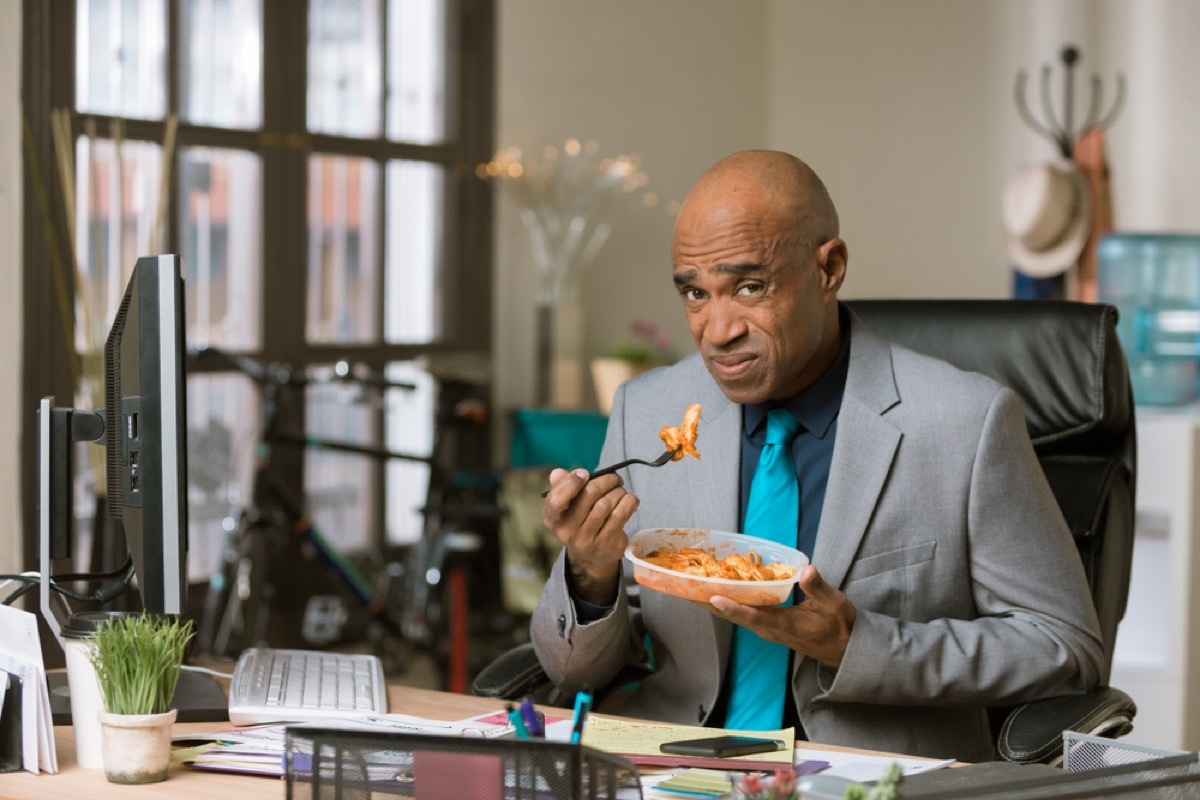 man not enjoying a dish of pasta, health changes over 40