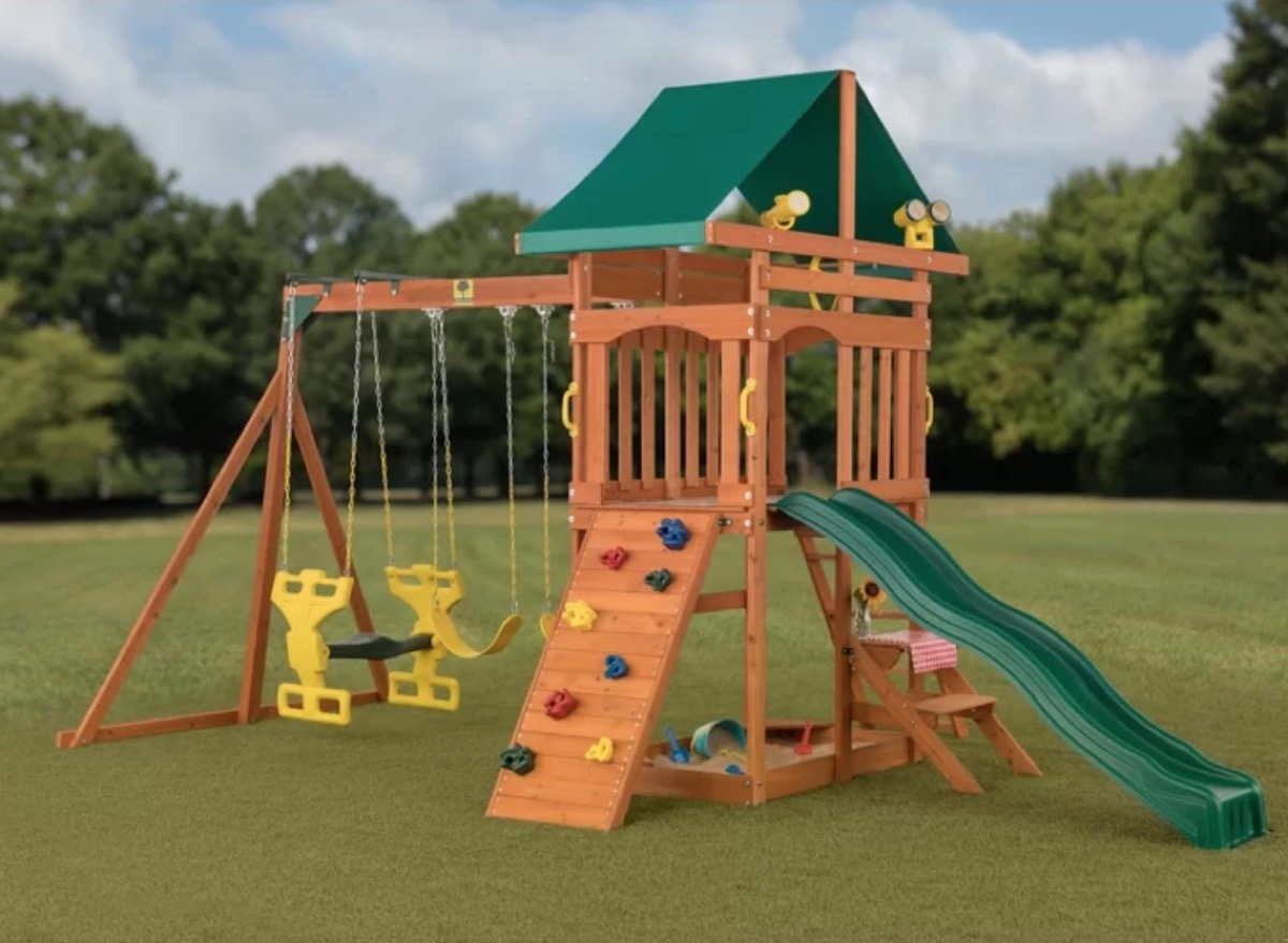 wooden swing set with climbing wall and slide, best outdoor toys for toddlers