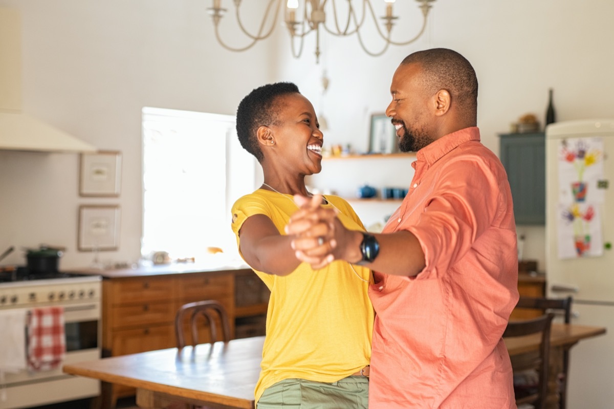 couple dancing in kitchen