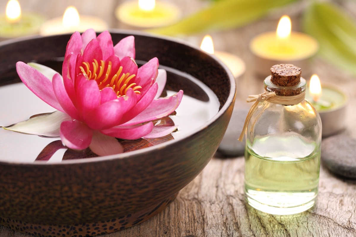 Spa still life with perfume bottle and lotus flower