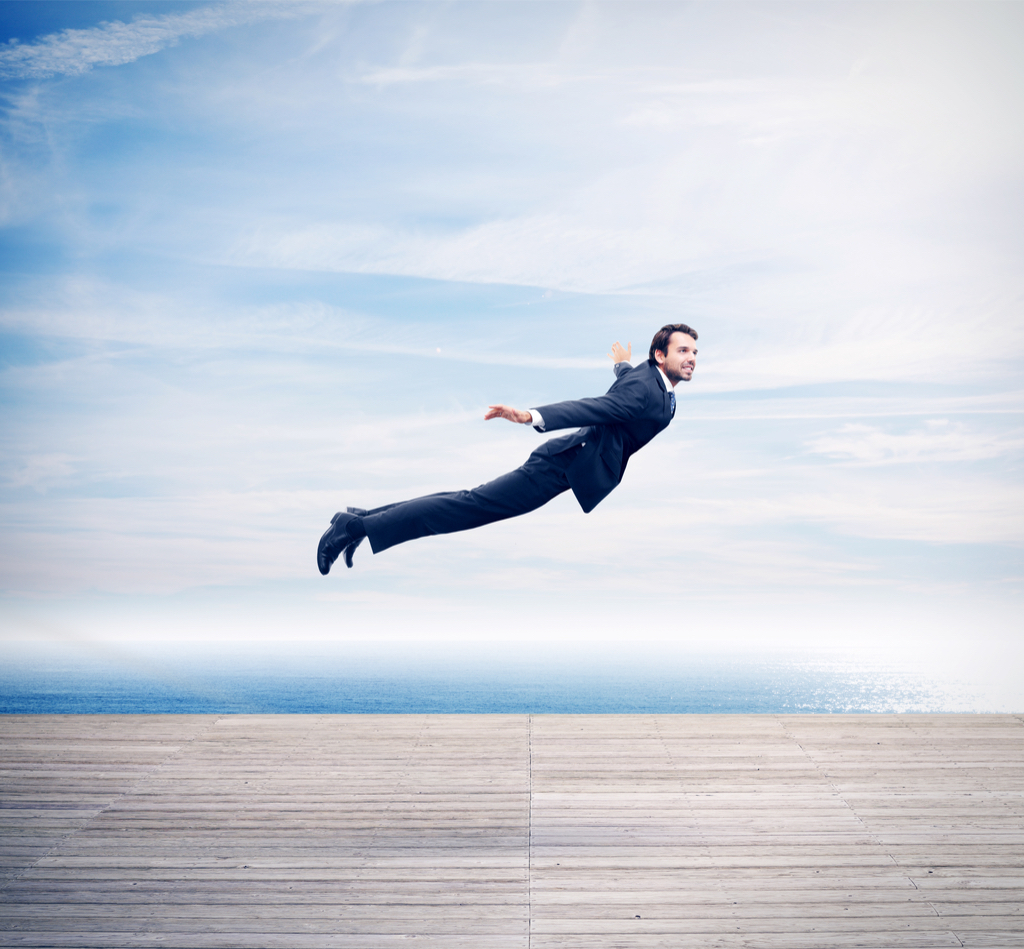 Man in suit flying