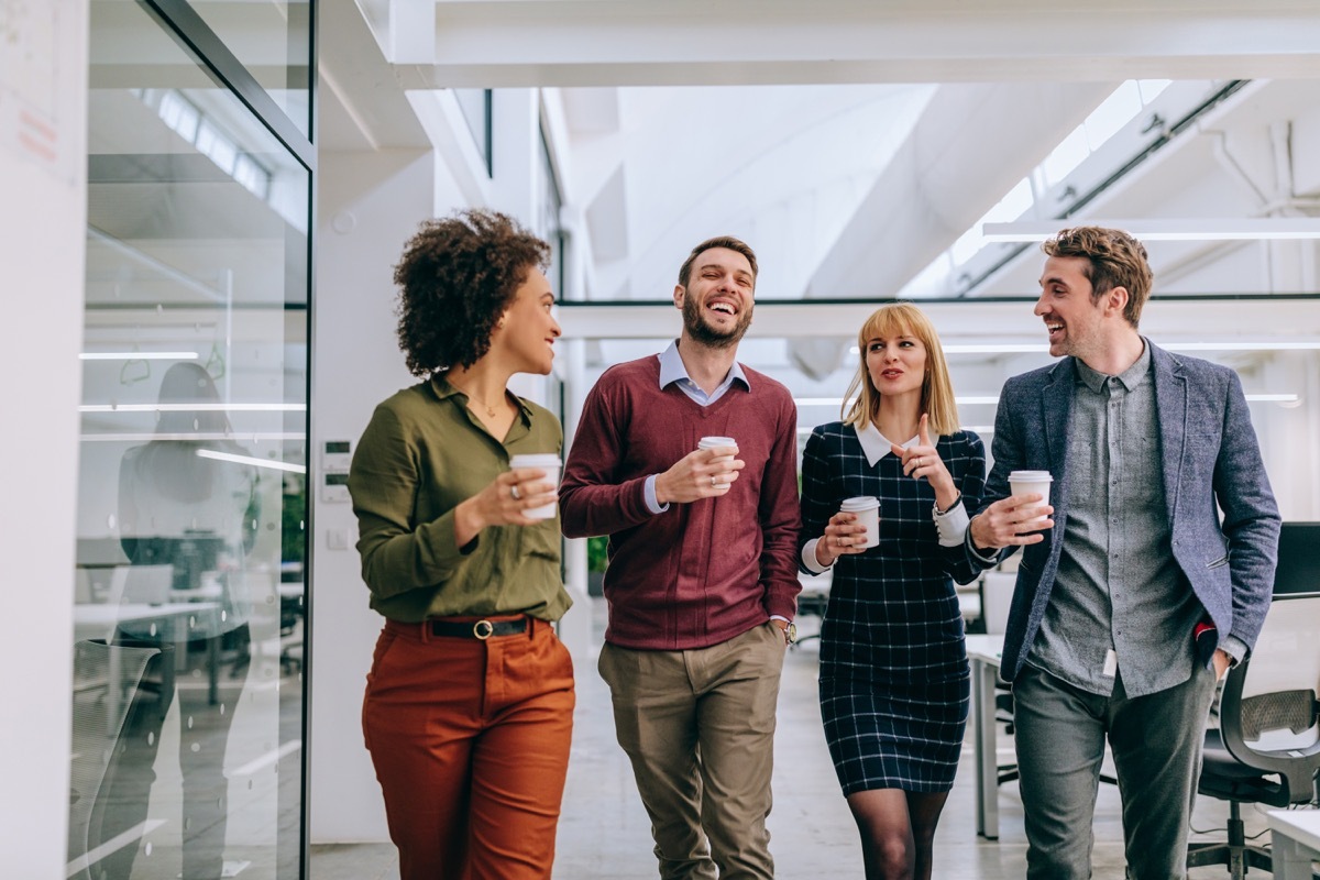 Group of friends in office getting coffee