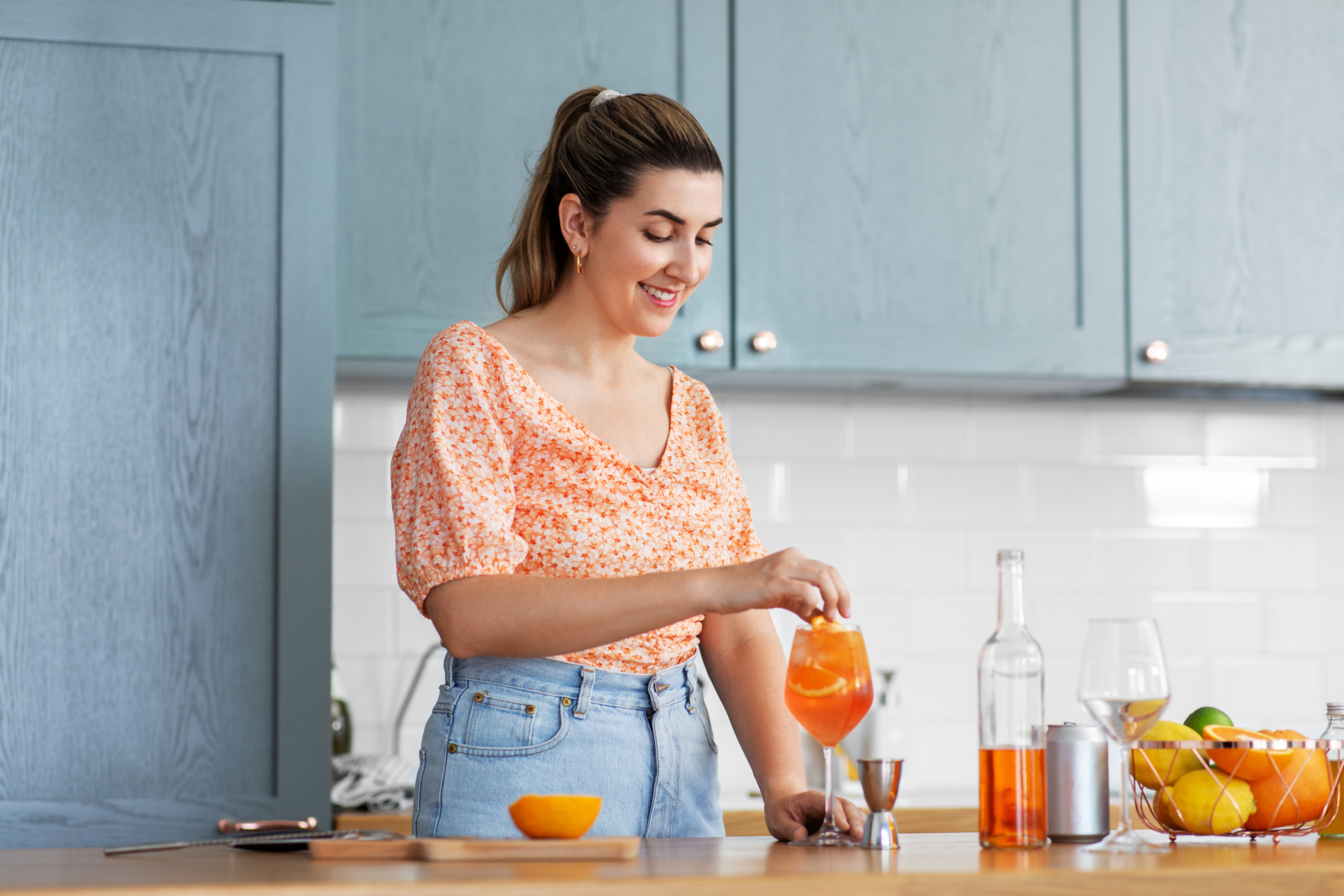 woman making cocktails at home