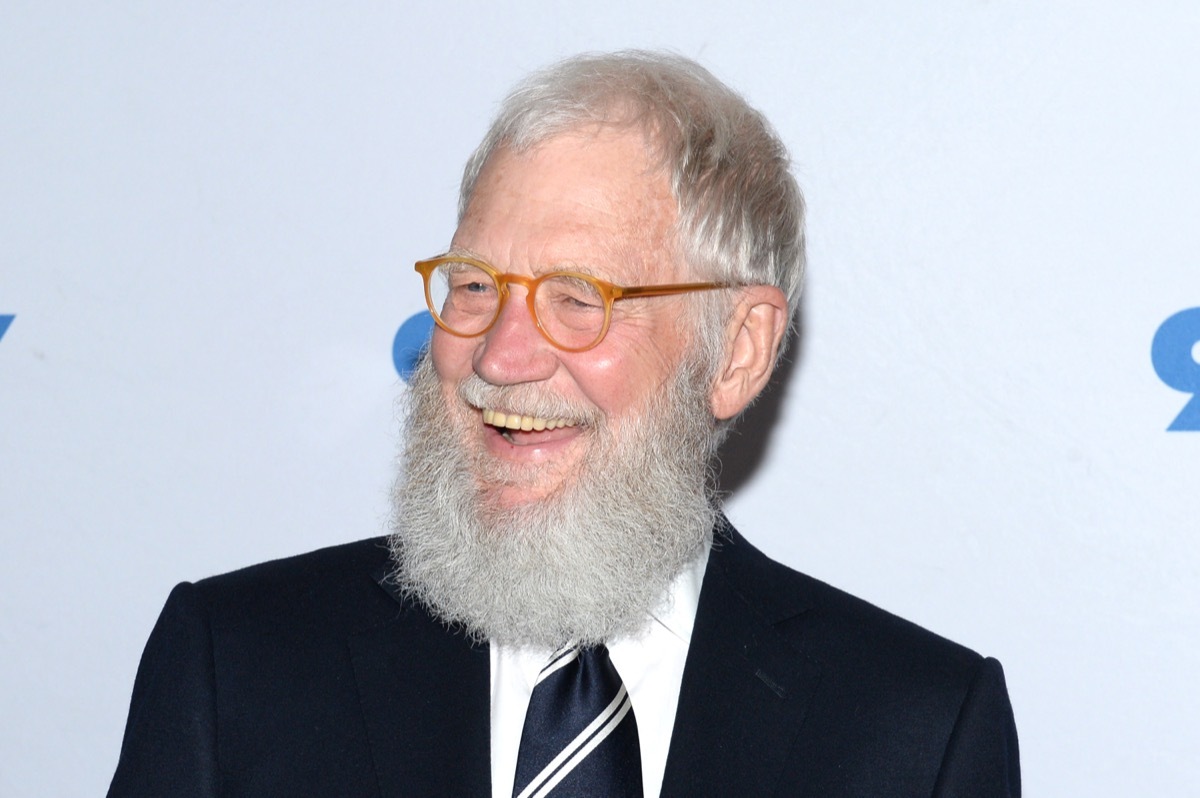 david letterman smiling in black suit on red carpet