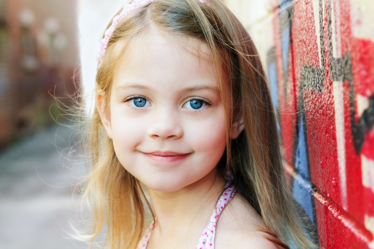 cute little girl smiling at the camera