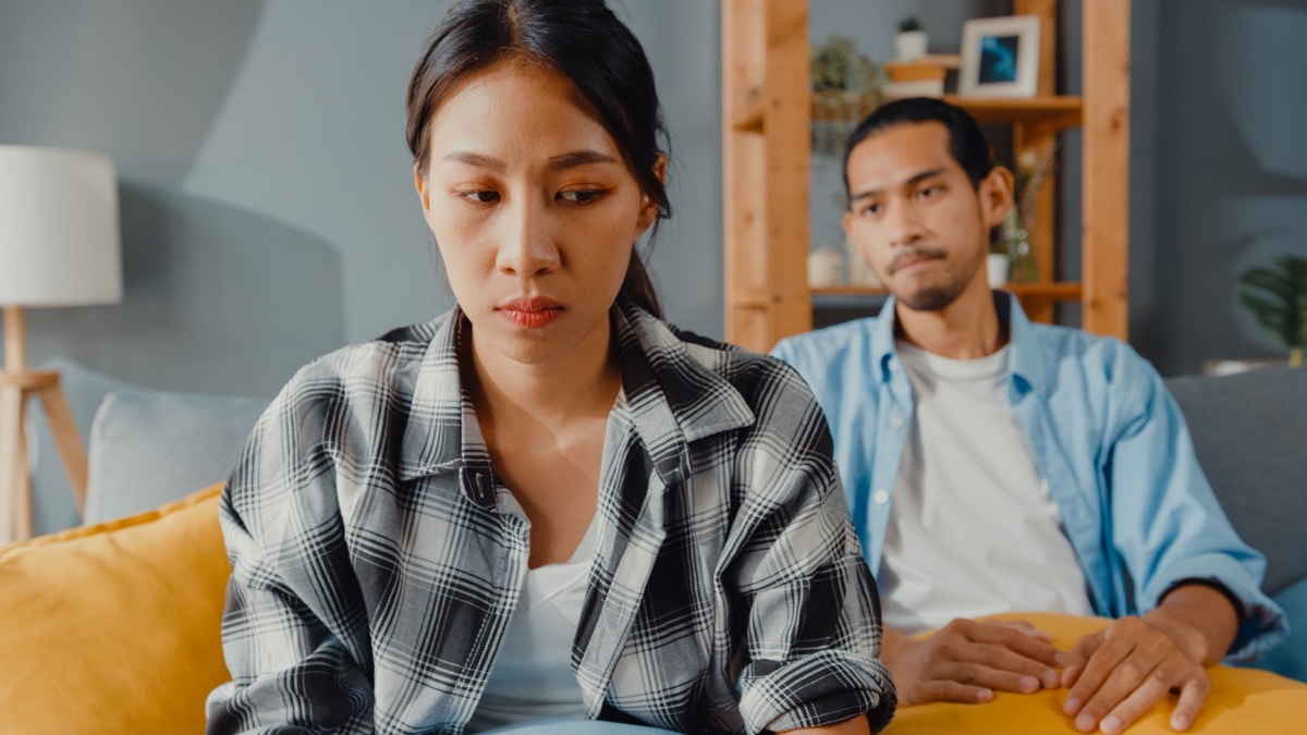 upset couple on couch