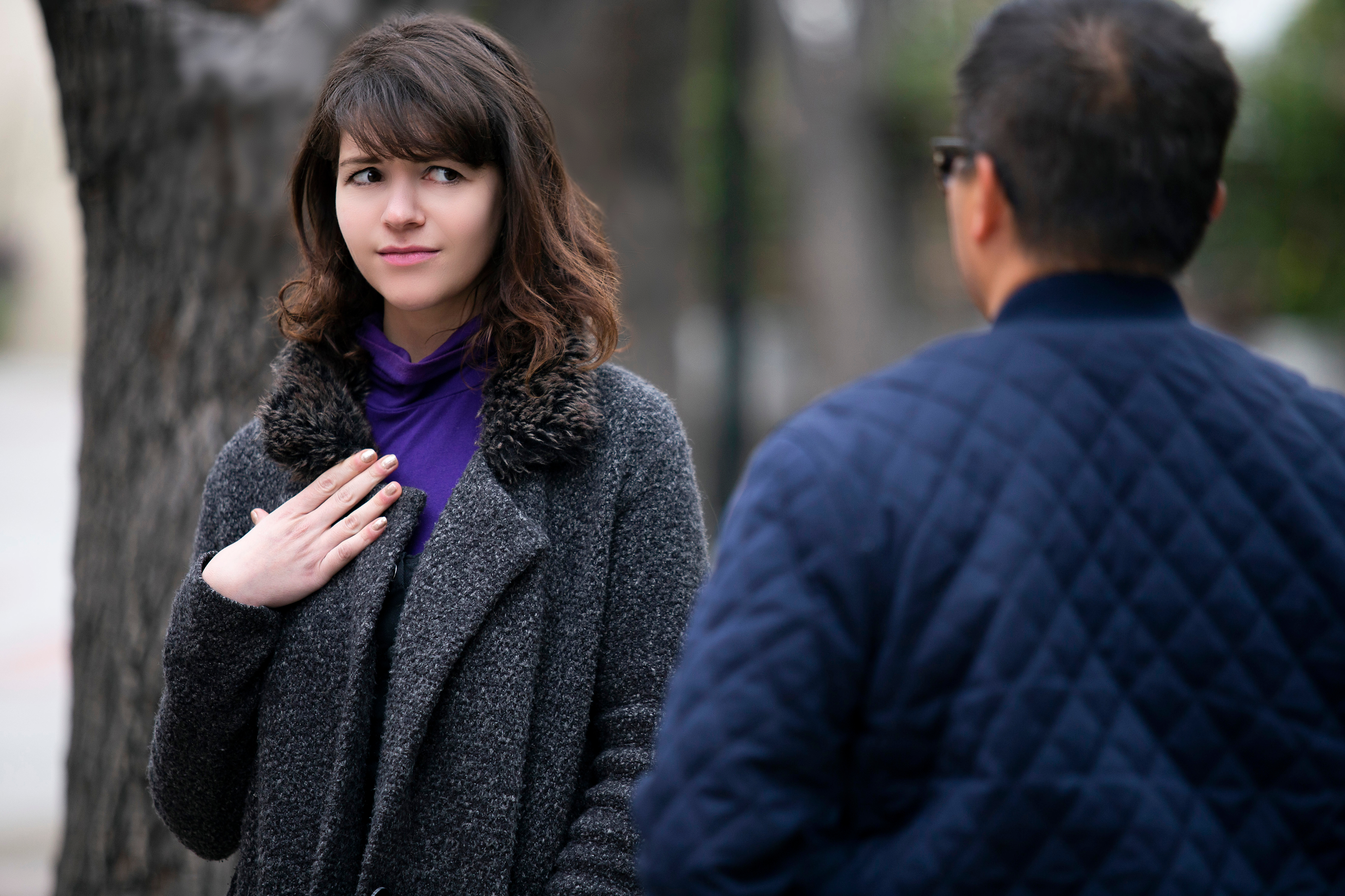 Woman looking uncomfortable around older man