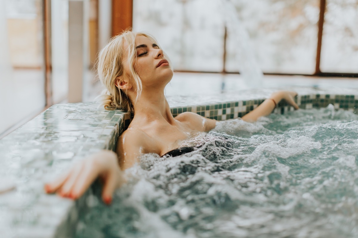 woman relaxing in the whirlpool bathtub