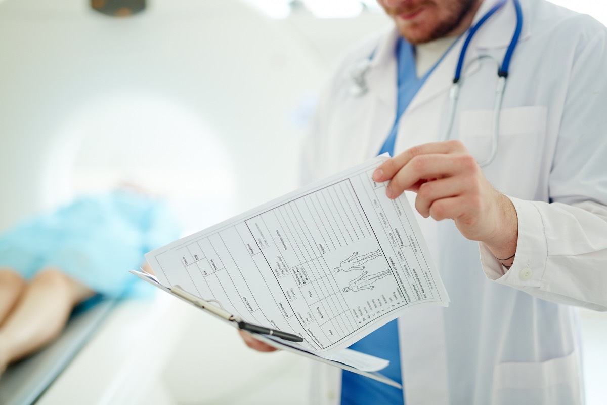 Doctor watching medical record of a patient