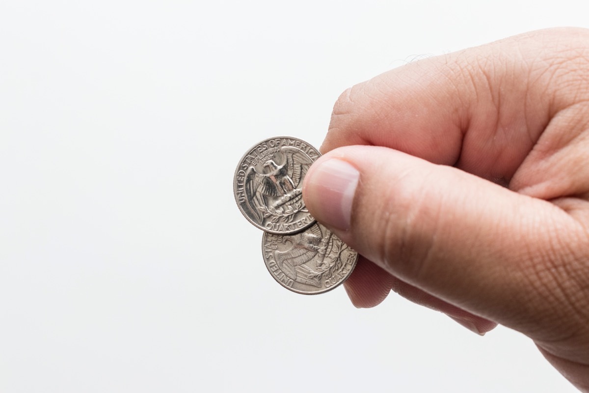 Man holding quarters