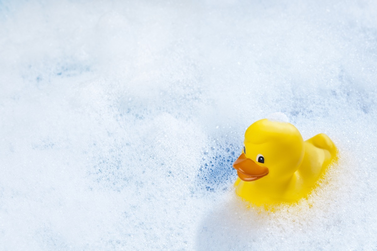 A yellow rubber duck in bathtub.