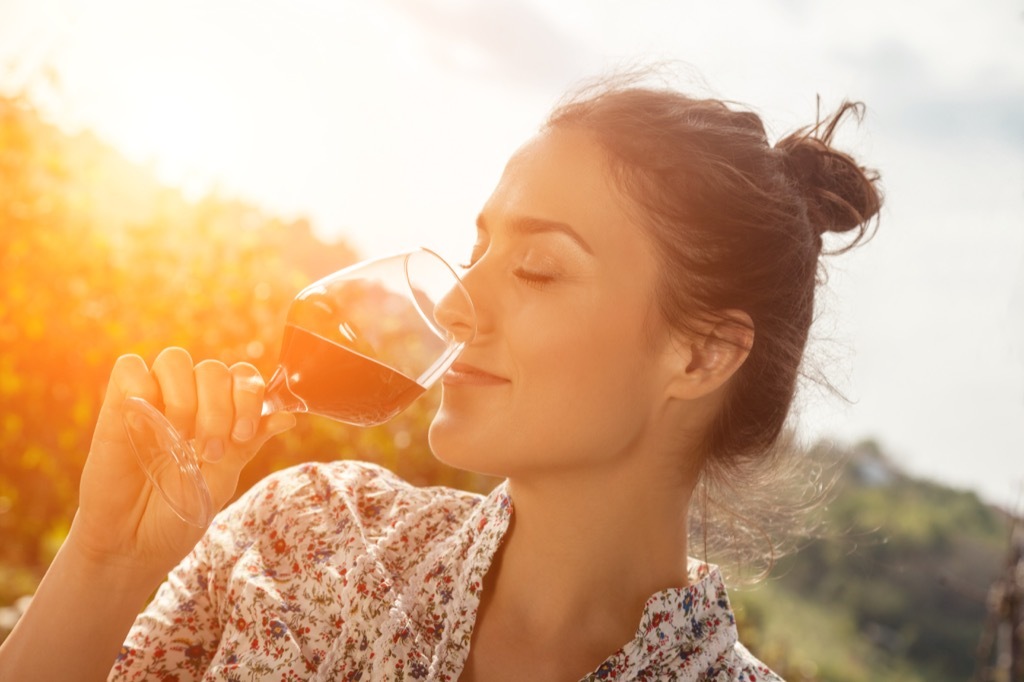 woman drinking wine stress stressed out benefits of wine