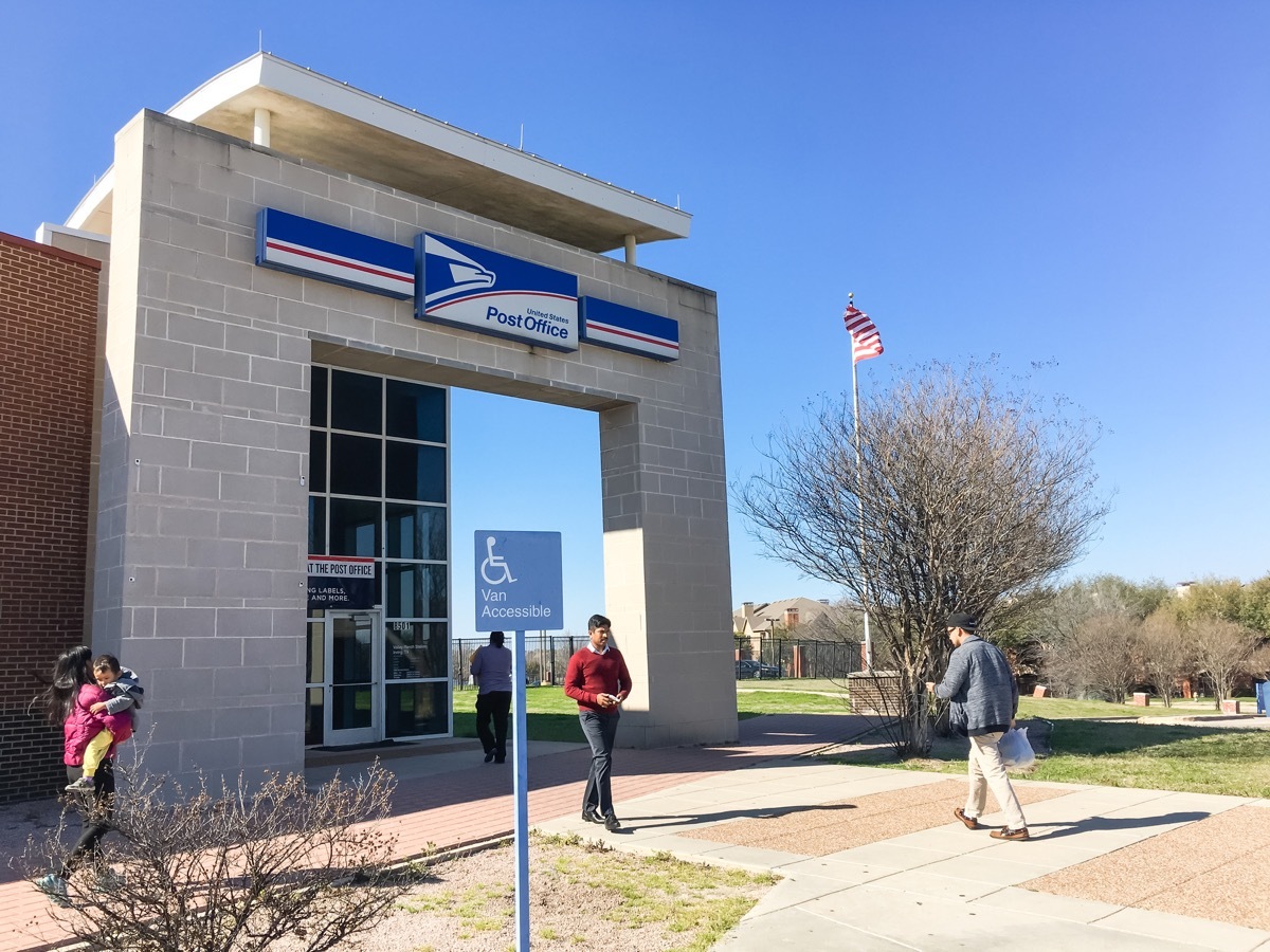 Entrance of USPS store with customers. The United States Postal Service is an independent agency of US federal government for providing postal service national wide