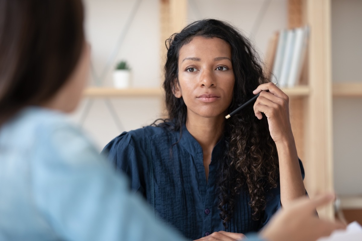 business woman in conversation with a coworker