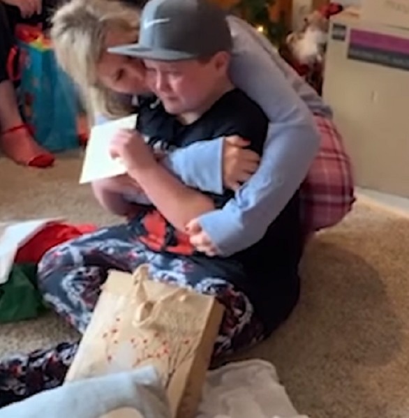 Overcome with emotion, Leah walked over to her nephew and wrapped her arms around him. 